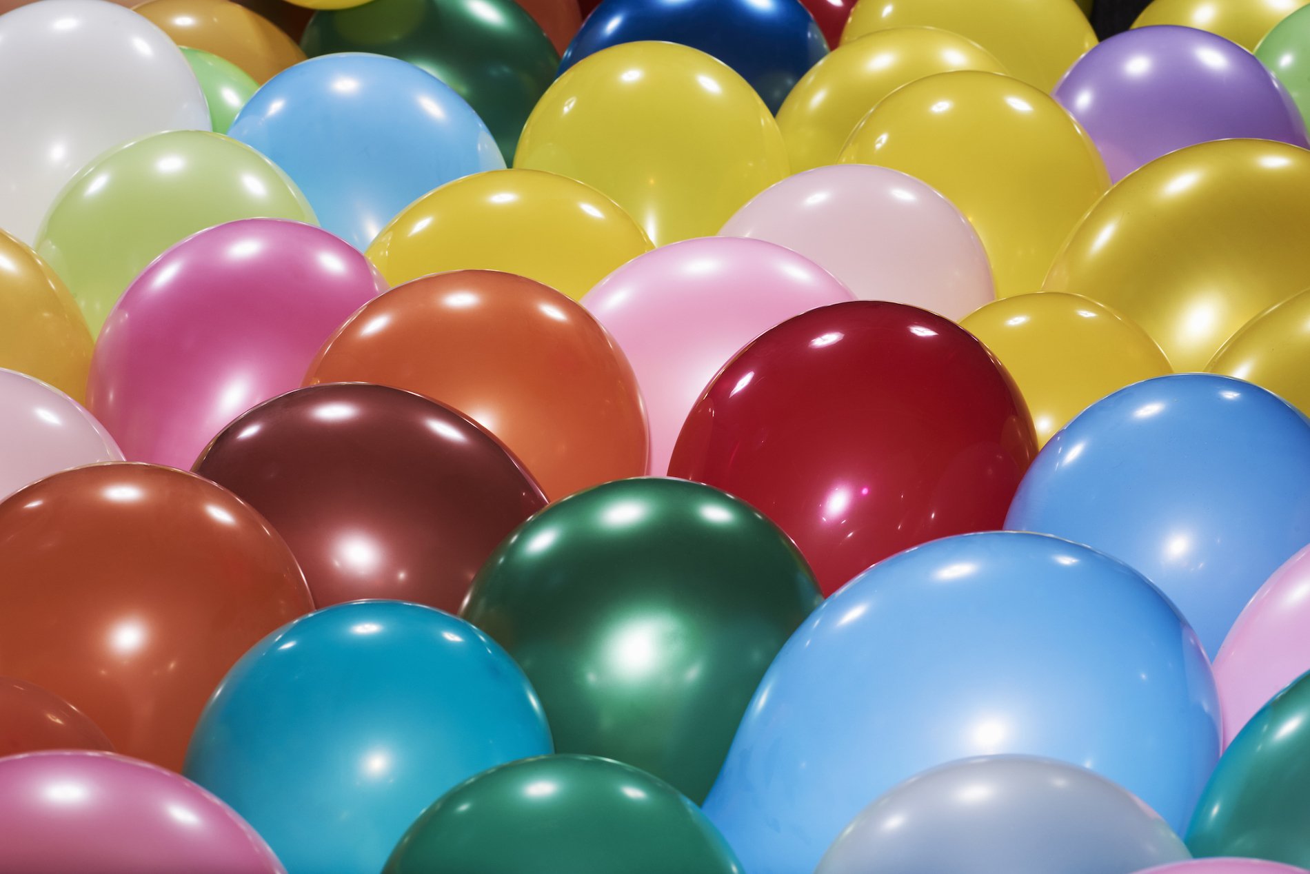 Close-up of lots of different coloured balloons
