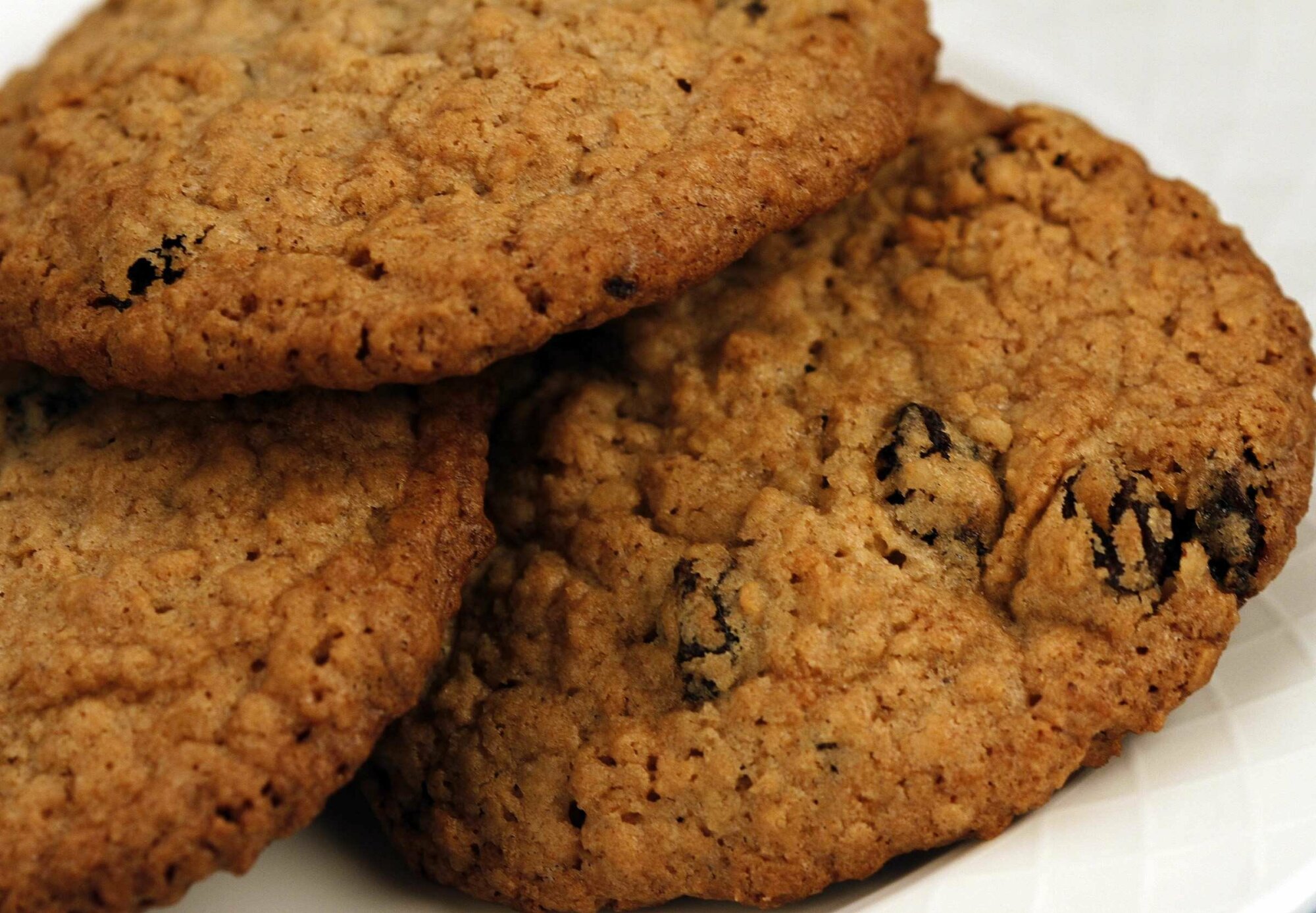 A plate of three cookies. 