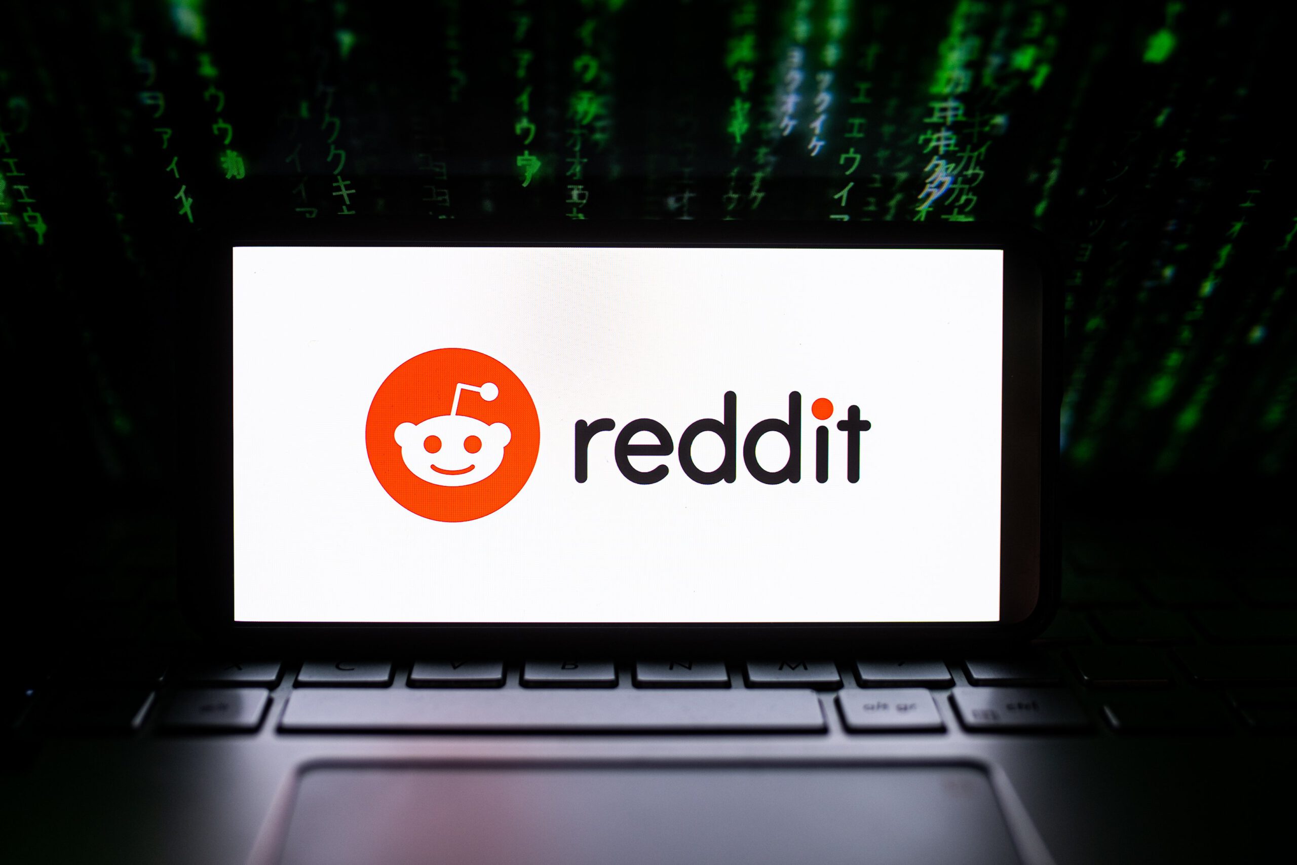 a computer with a Reddit Logo