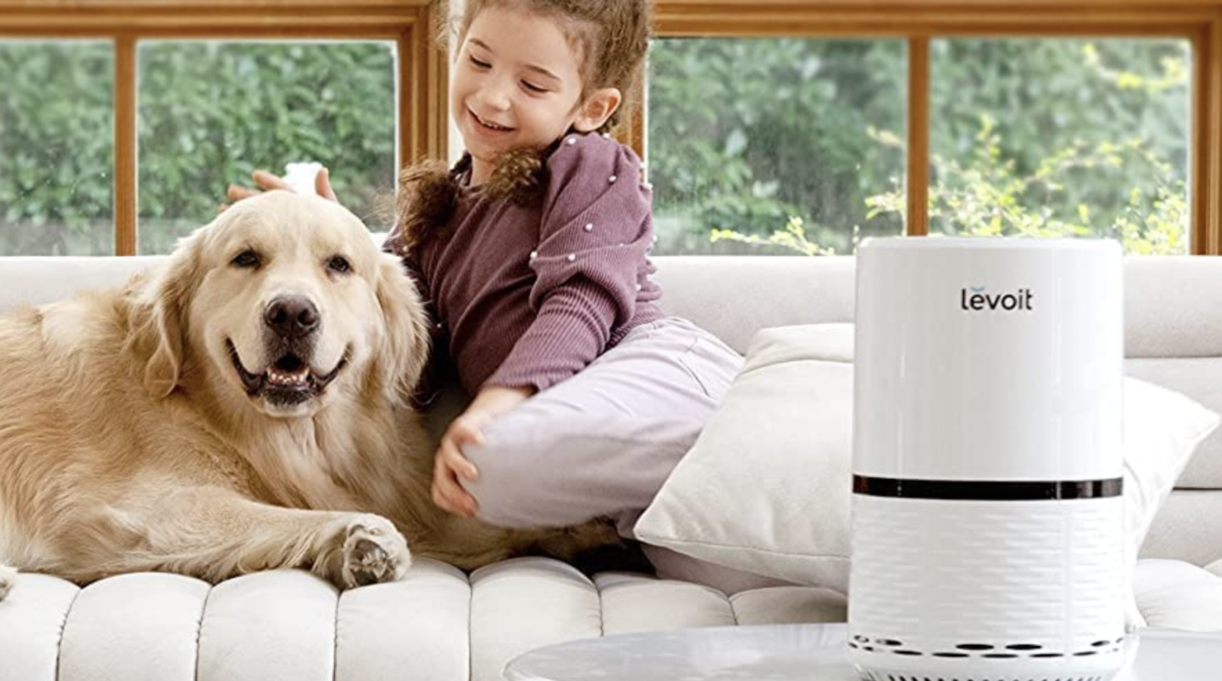 girl and dog sitting beside air filter