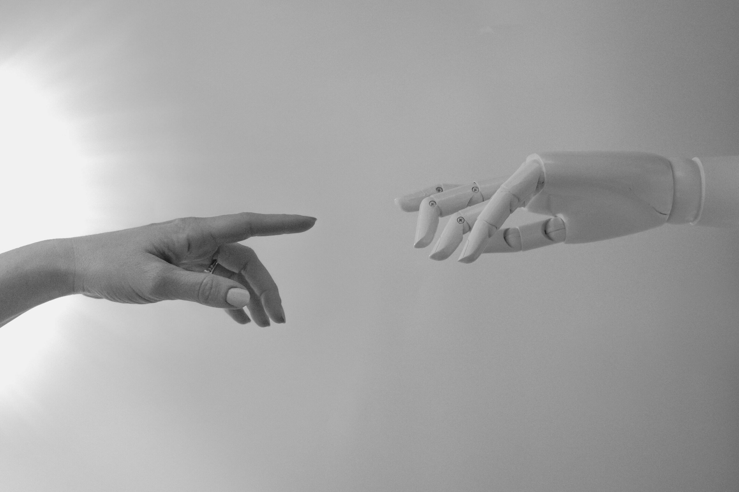 Human hand reaching for robot hand