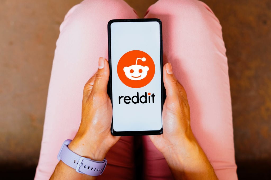 Reddit logo on phone screen