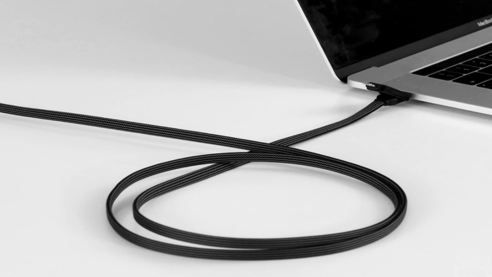 laptop with incharge x max charging cable connected