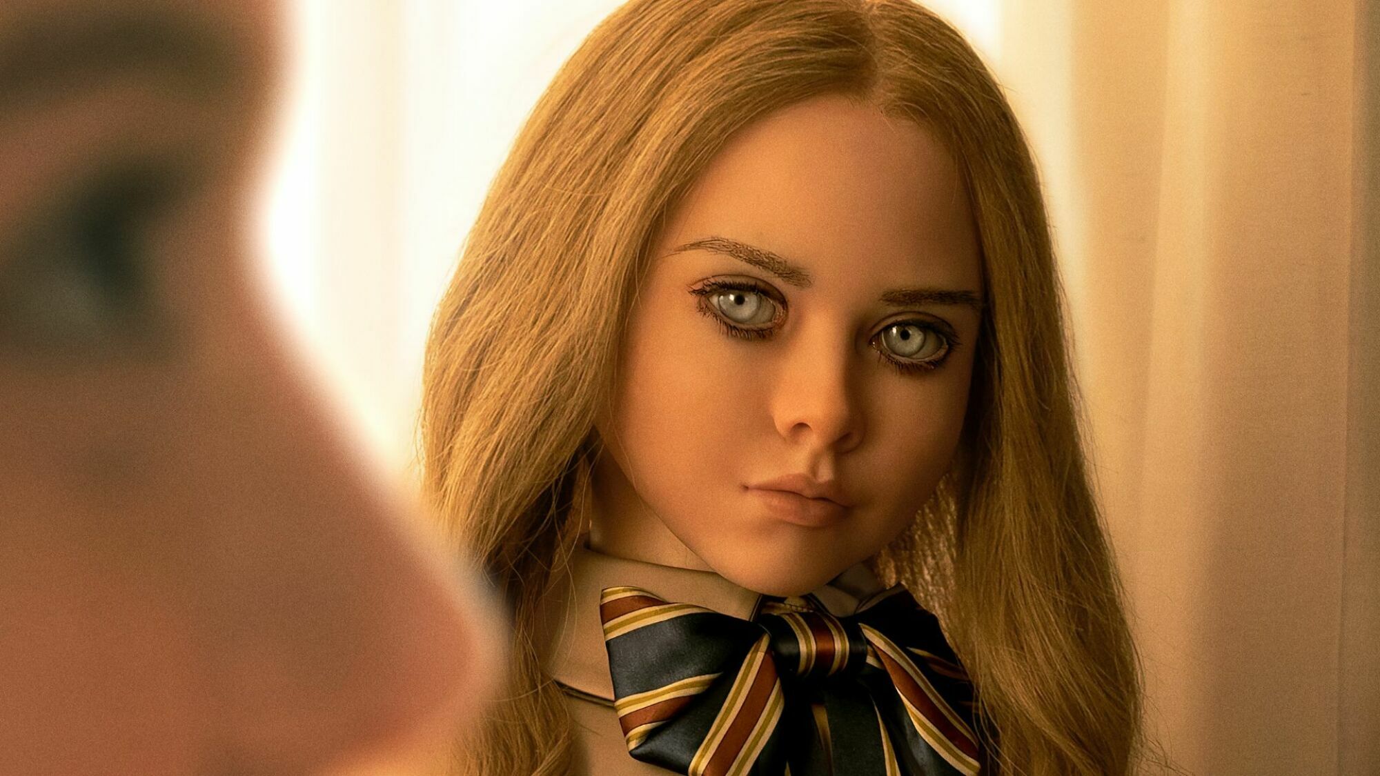 A blonde doll stares menacingly in "M3GAN." 