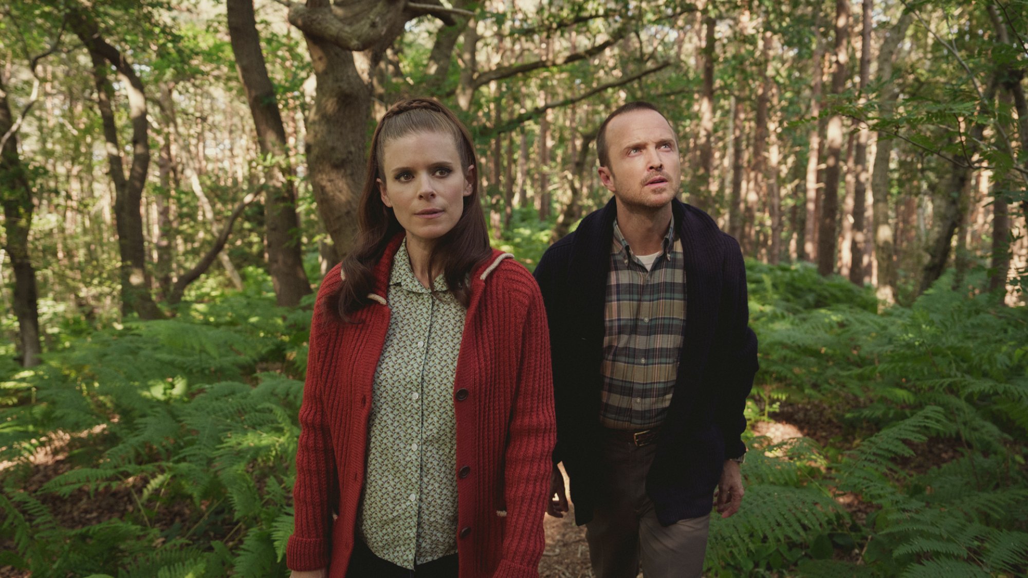 In the TV show "Black Mirror" Kate Mara and Aaron Paul walk through a wood.