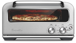 Silver colored pizzan oven with pizza inside