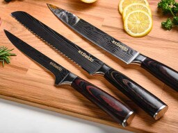 three knives on a cutting board
