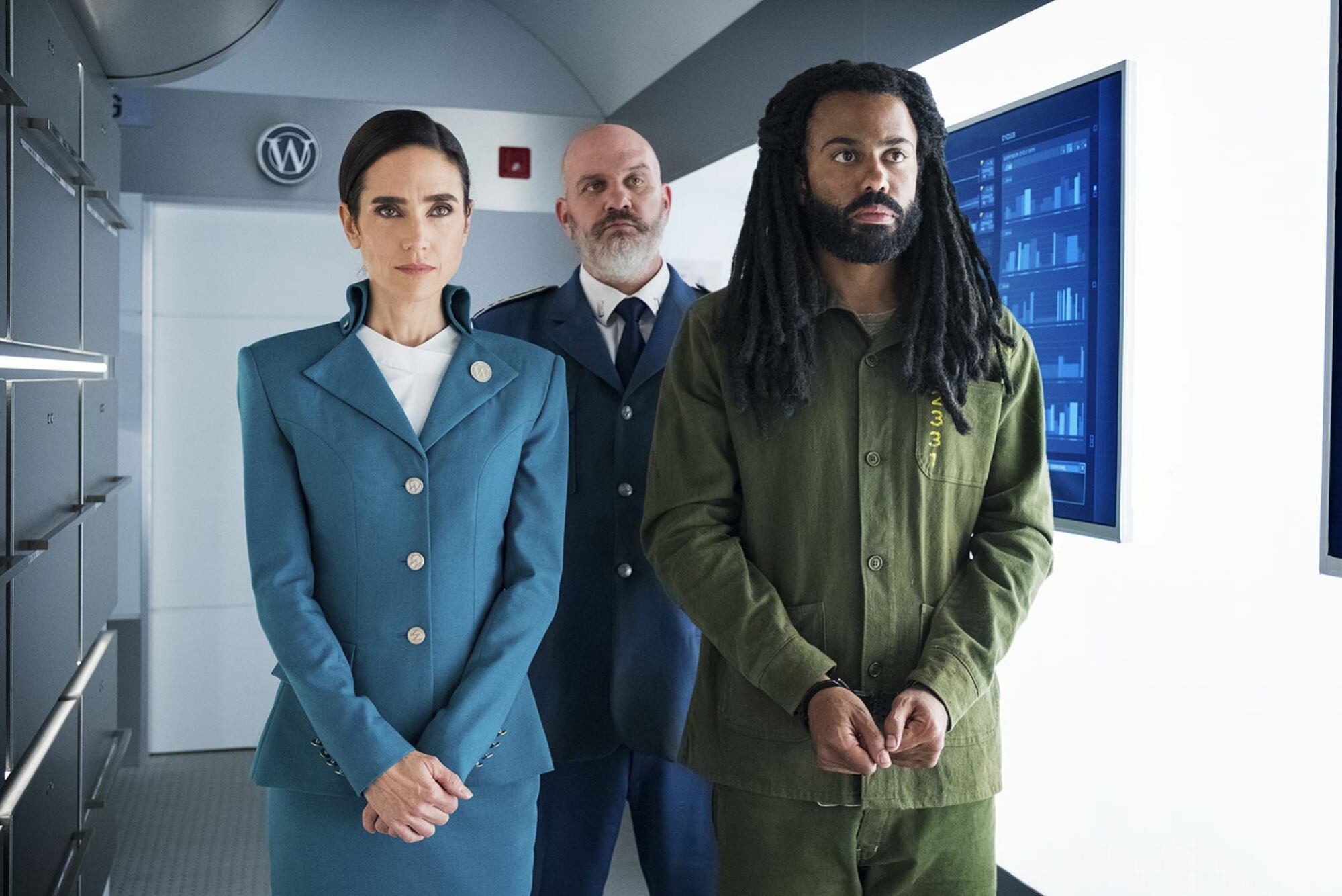 Jennifer Connelly stands next to Daveed Diggs who is in handcuffs