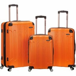 Three-piece Rockland London hardside spinner wheel luggage in a bright orange color