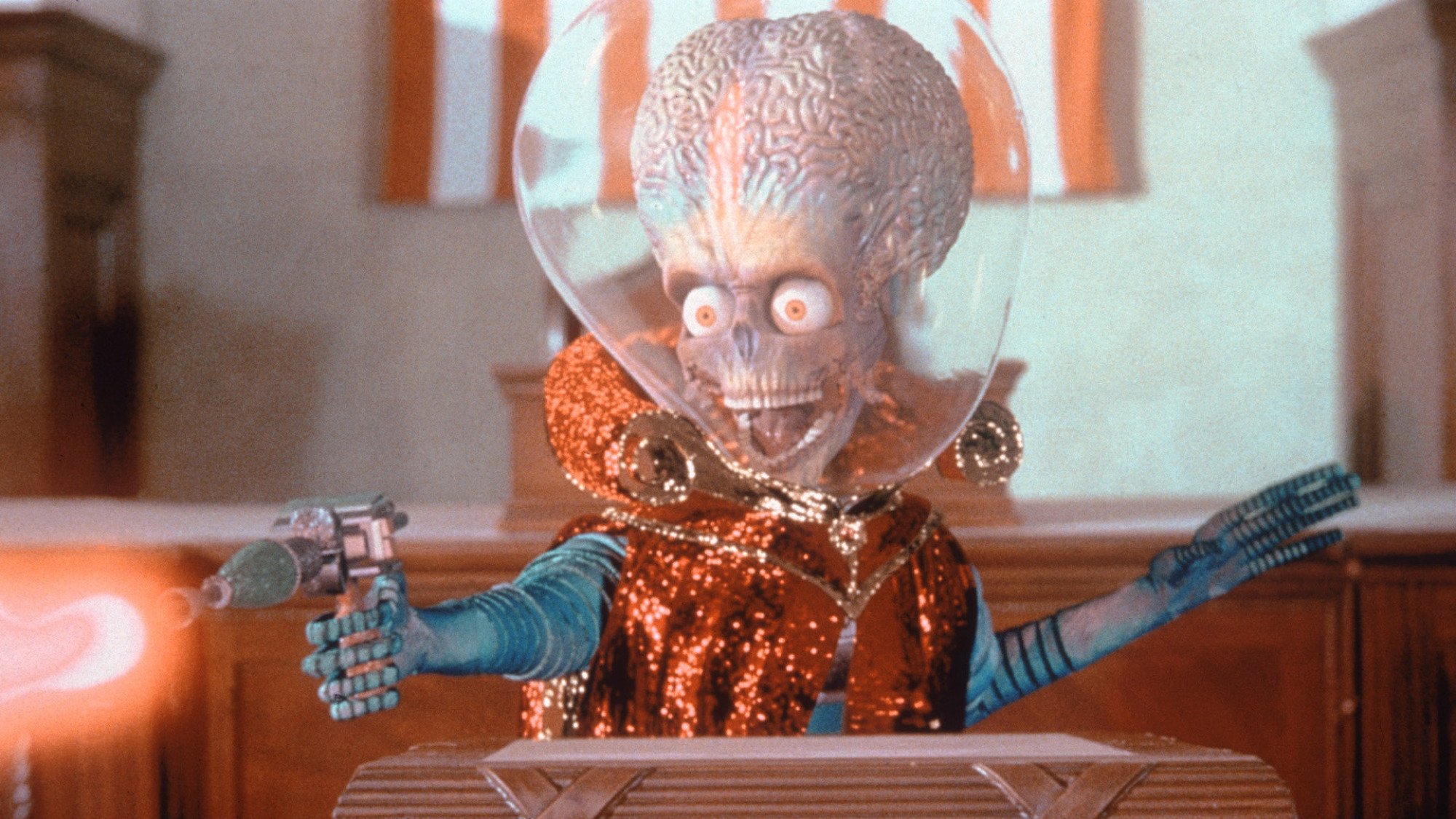 An alien with a blaster in the movie "Mars Attacks!"
