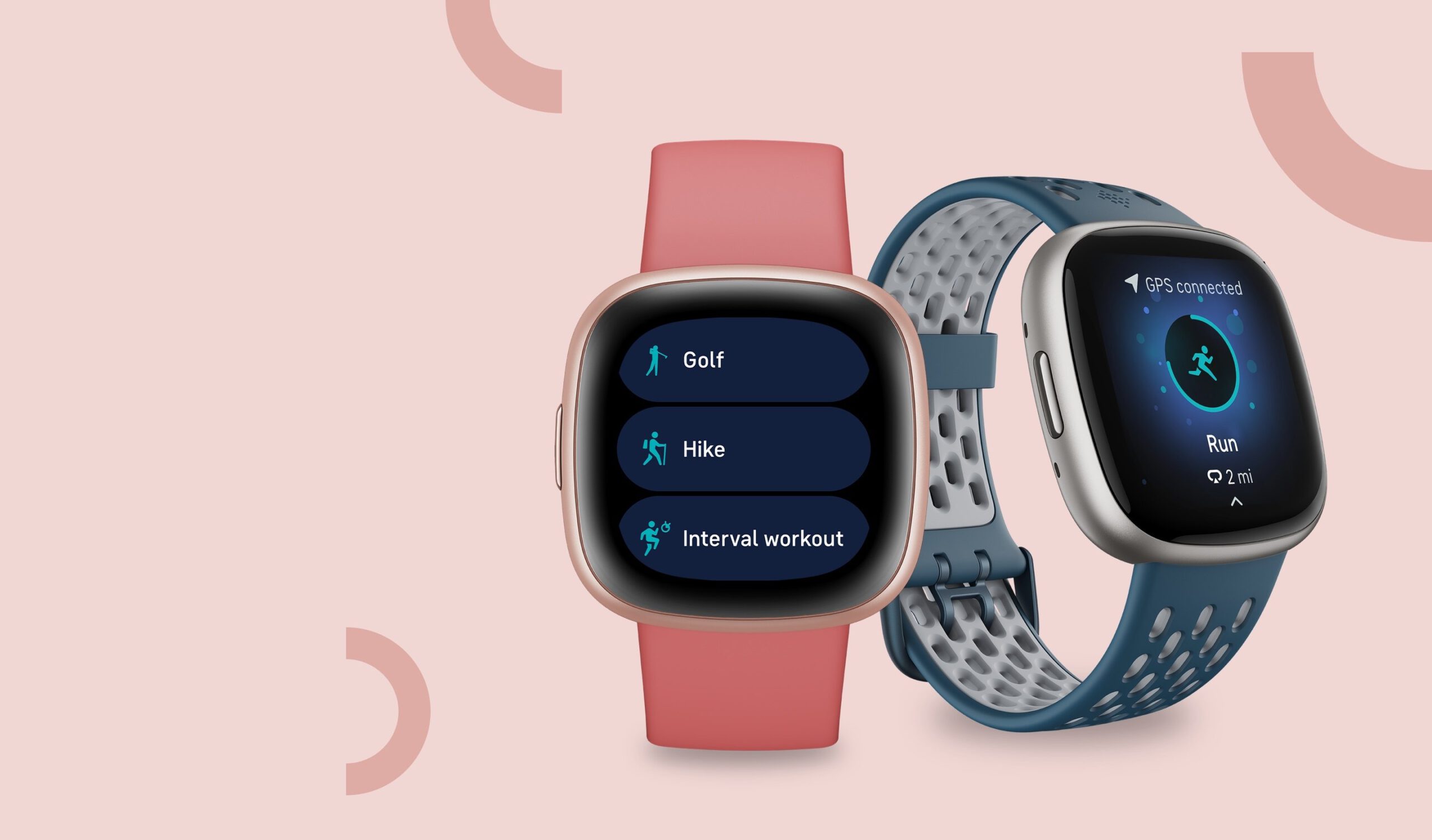 Two Fitbit Versa smartwatches on a pink background