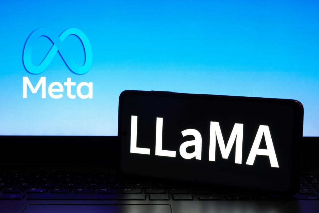 Llama logo on a smartphone in front of the Meta logo
