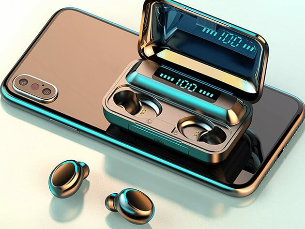 The Flux 7 TWS earbuds in a metallic color lying next to a phone and their case