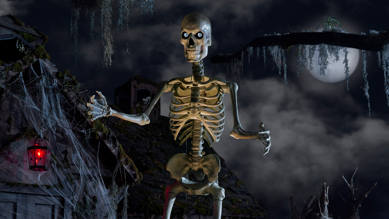 the 12-foot home depot skeleton in front of a dark, spooky background lit by a full moon