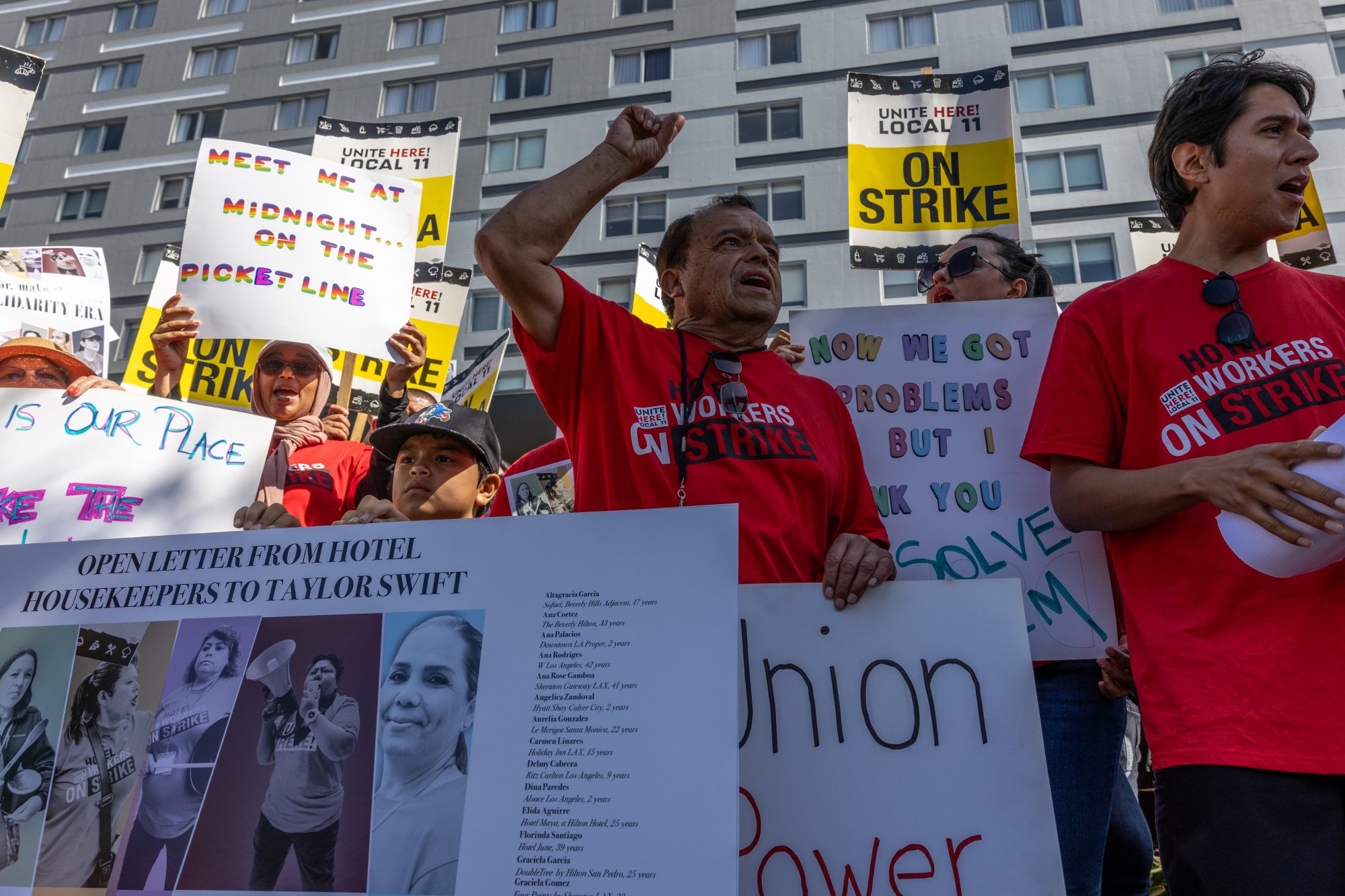 A group of striking hotel workers picket in front of a Los Angeles hotel. 