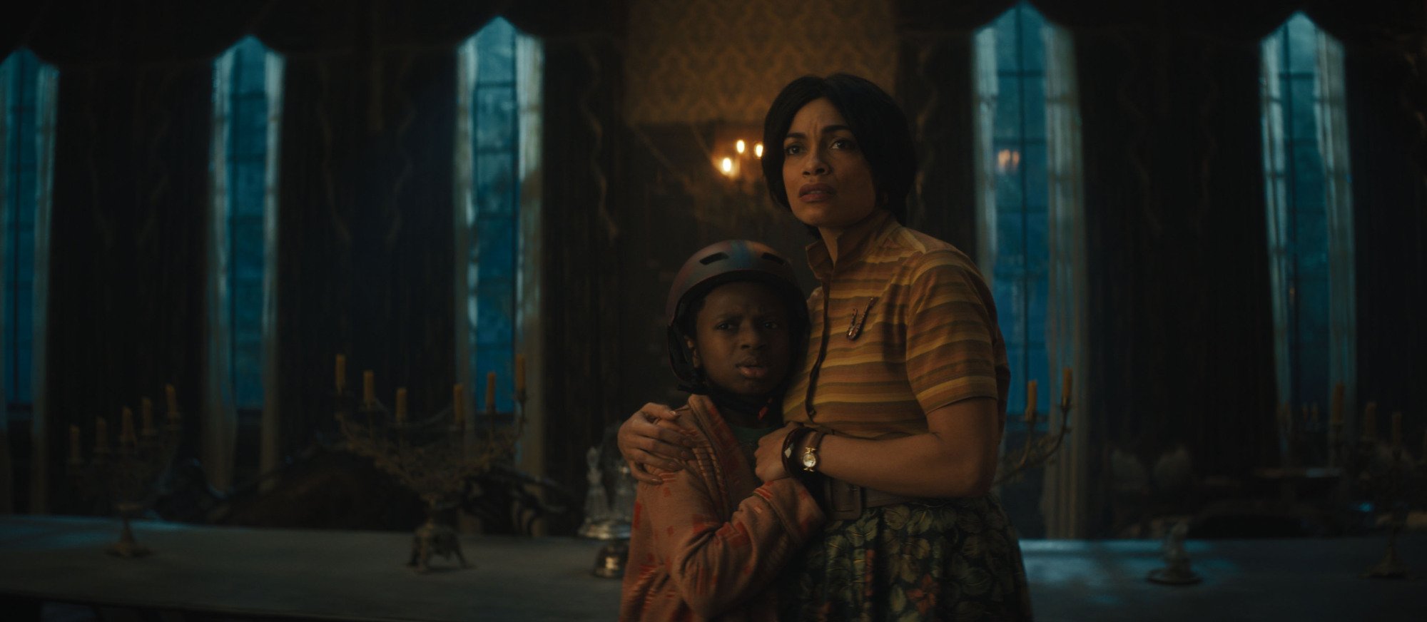 Chase Dillon as Travis and Rosario Dawson as Gabbie in Disney's live-action "Haunted Mansion."
