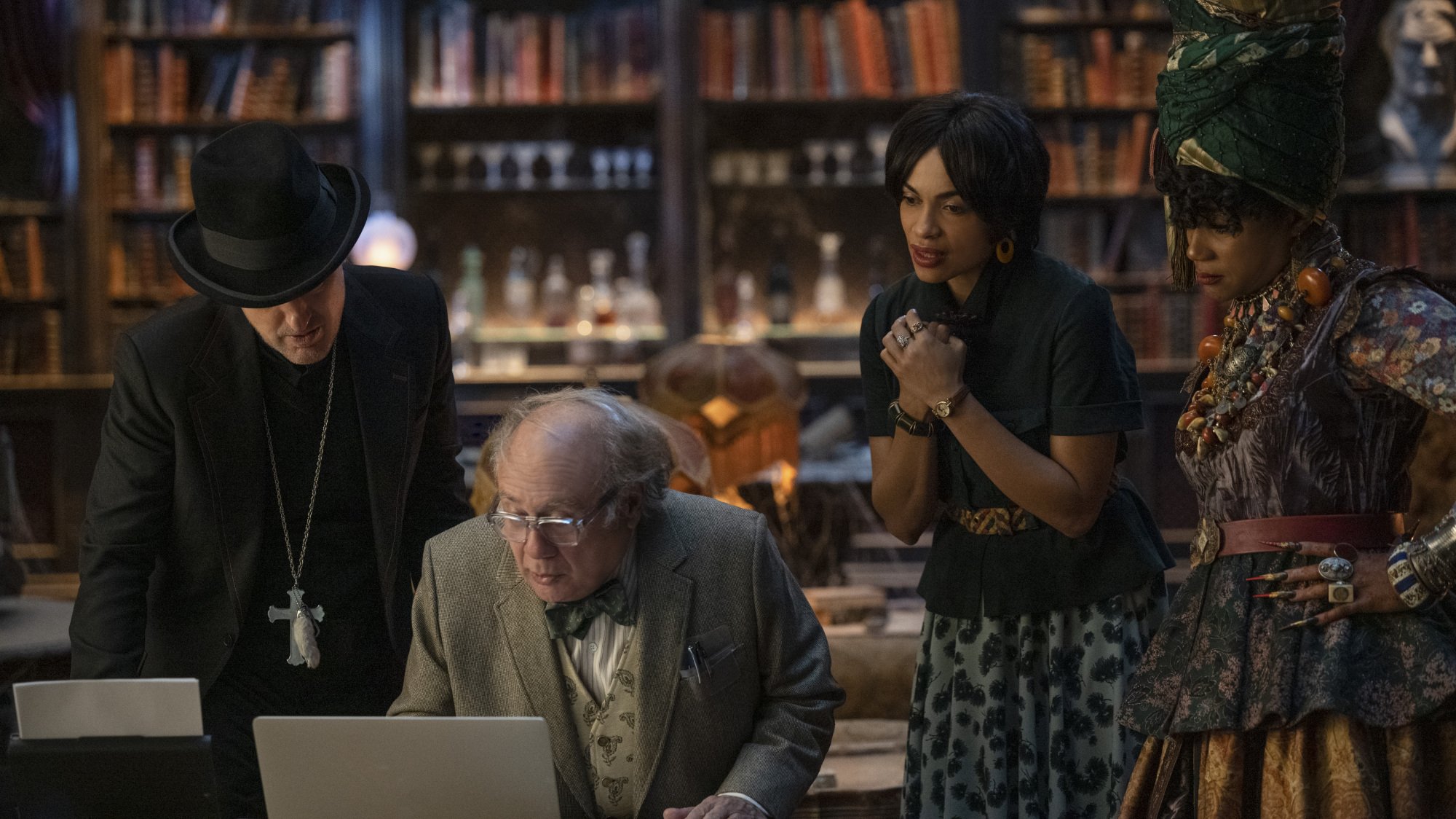 Owen Wilson as Father Kent, Danny DeVito as Bruce, Rosario Dawson as Gabbie, and Tiffany Haddish as Harriet in Disney's live-action HAUNTED MANSION.