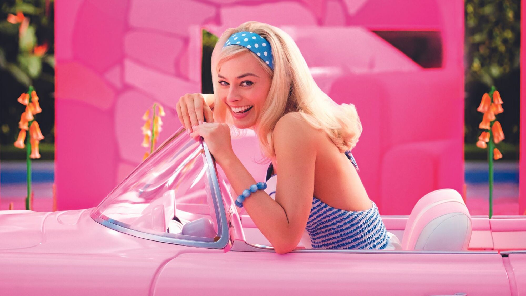 Barbie in a bright pink car