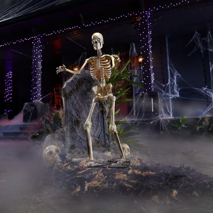 the 3-foot led skeleton in front of a house decorated for halloween