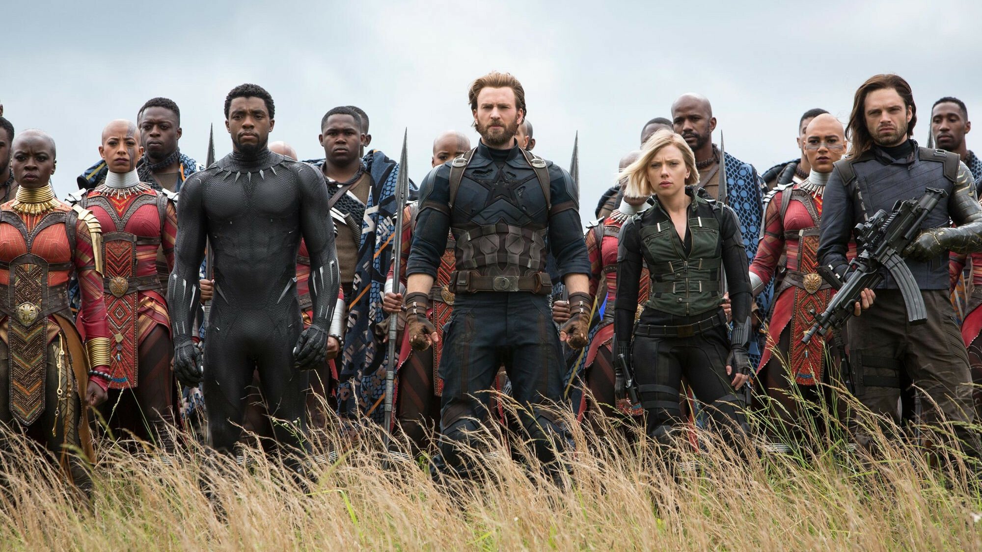 A promotional photo from Avengers: Infinity War, showing Black Panther, Captain America, Black Widow, the Winter Soldier, and numerous Wakandans ready for battle.