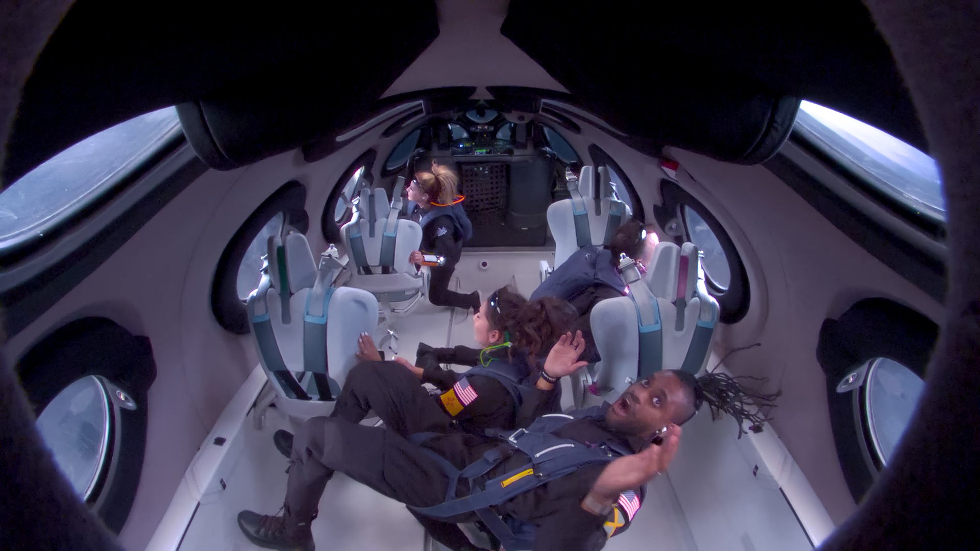 Astronauts in weightlessness in a Virgin Galactic flight.