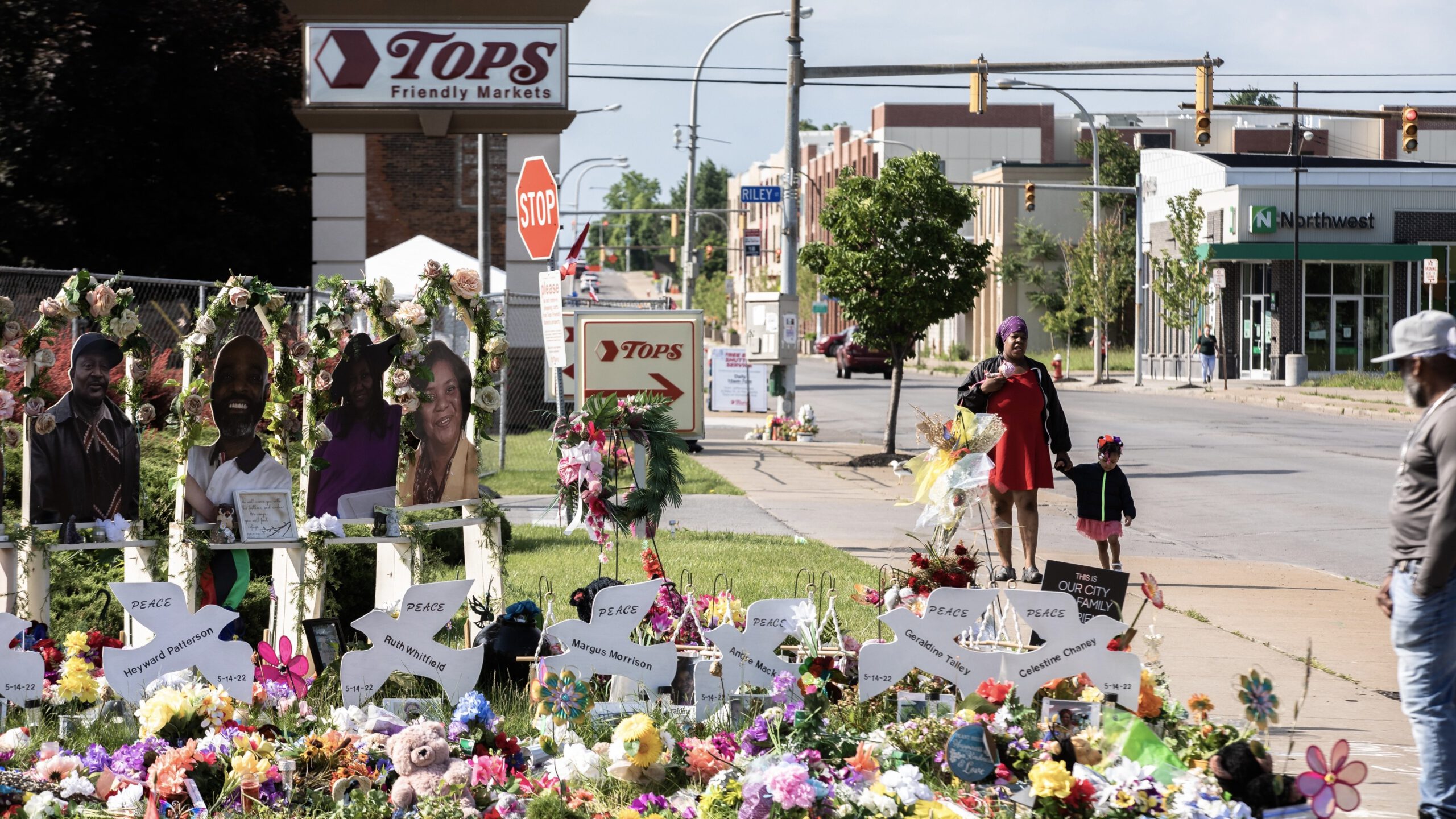 A memorial of photos for victims of the Buffalo, New York, mass shooting at Tops grocery store.