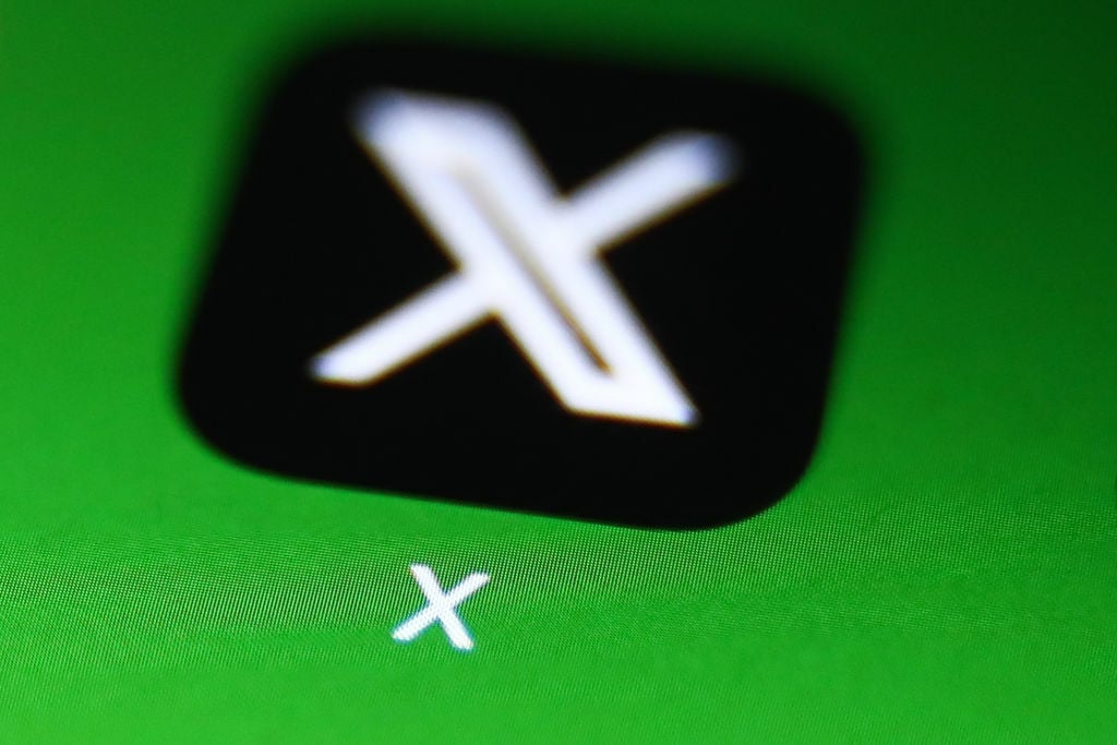 X app icon on phone screen