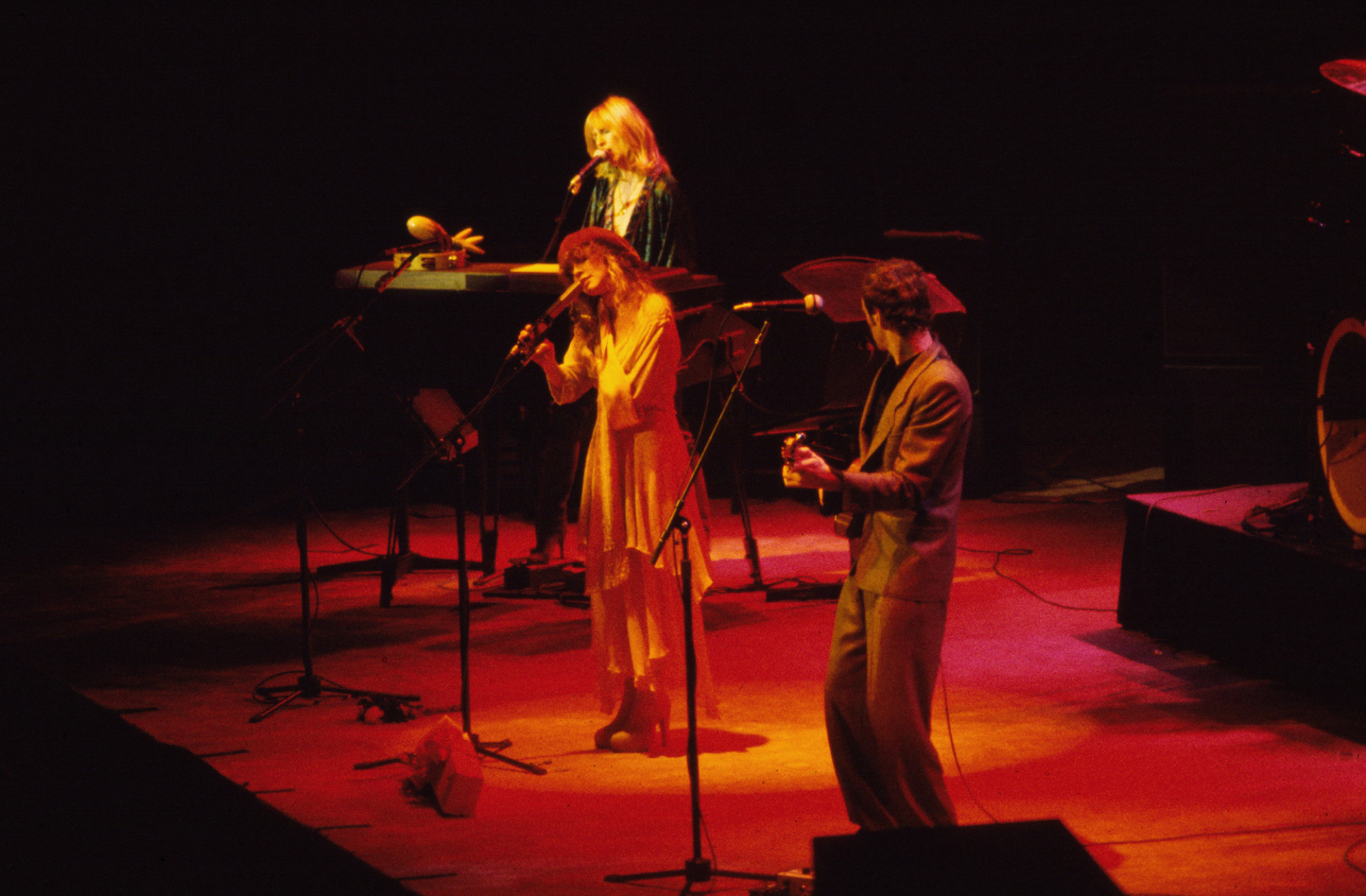 Christine McVie (top), on keyboards, vocalist Stevie Nicks (center), and Lindsey Buckingham, on guitar, all of the group Fleetwood Mac, perform onstage at Madison Square Garden, New York, New York, November 15, 1978.