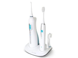 Water flosser, sonic toothbrush, and inductive charging base set overlaid on a white background