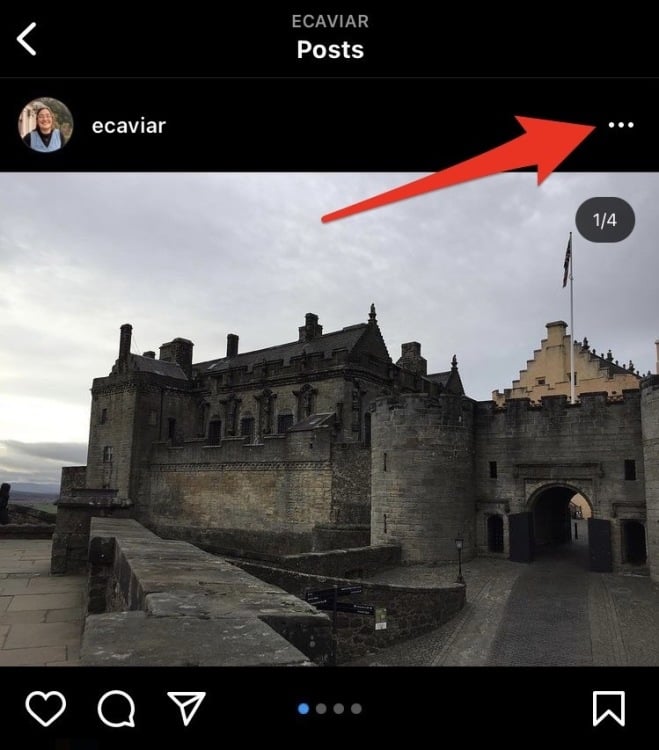 Screenshot of an Instagram post with a red arrow pointing to the three dots in the upper right hand corner. 