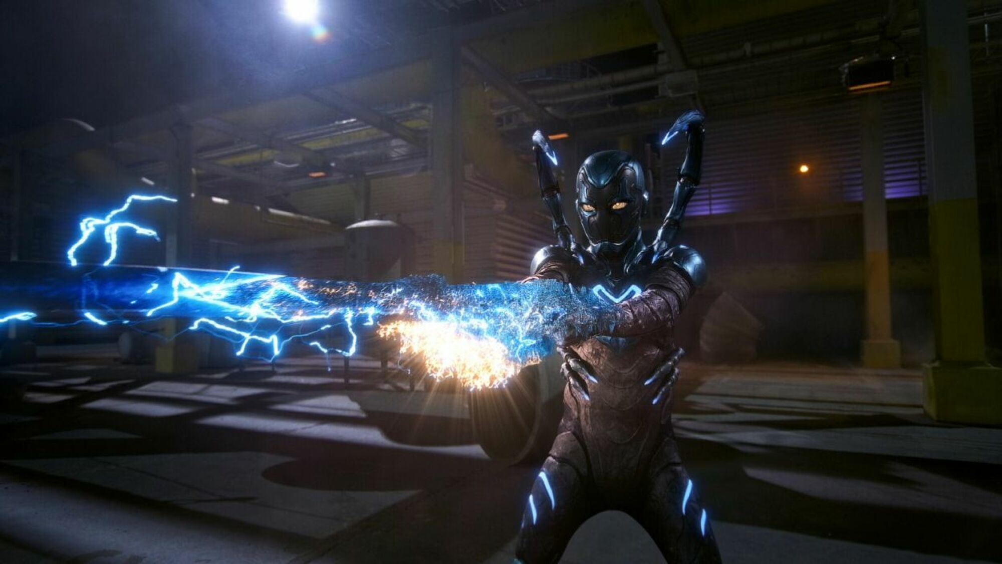 An armored superhero shoots out a blue laser. 