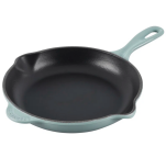 cast iron skillet with light green exterior