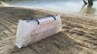 Folded Oru Lake Kayak on a sandy beach