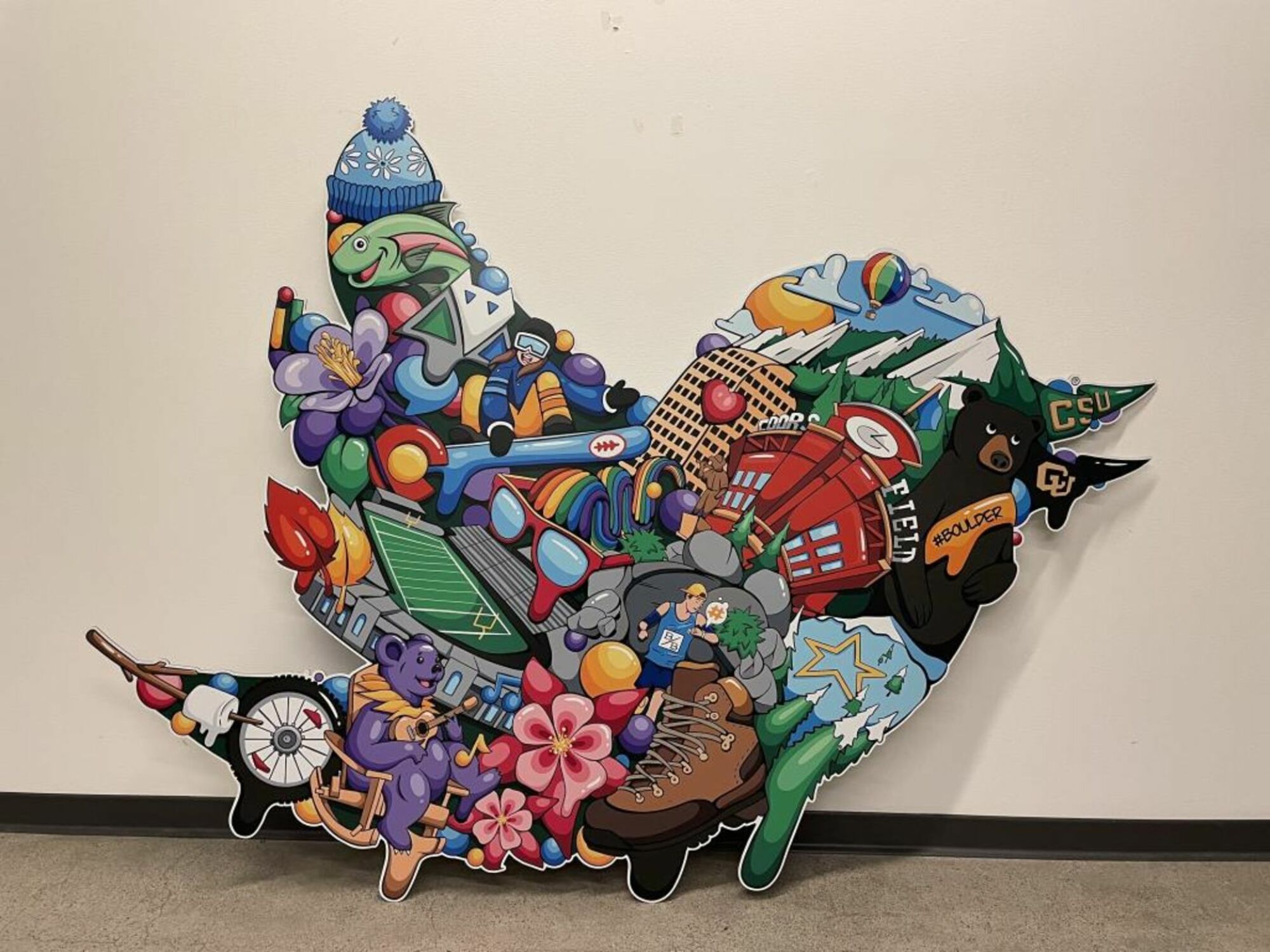 A colorful collage in the shape of the Twitter bird logo.