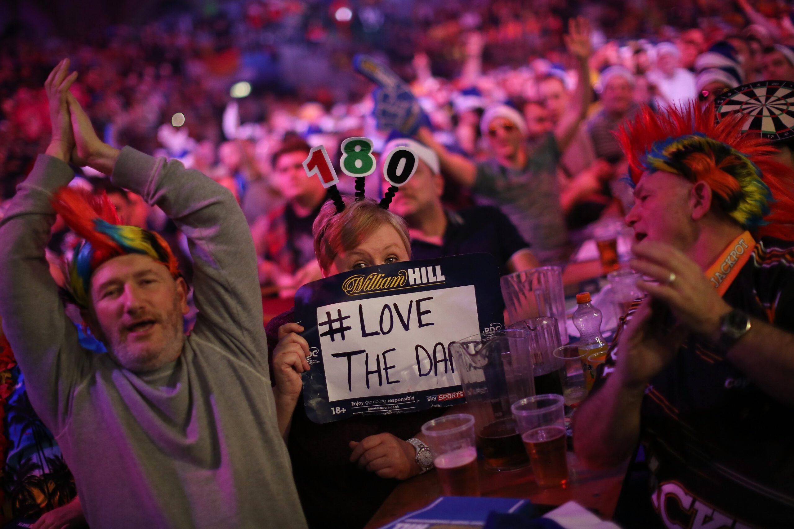 Darts fans watch the action