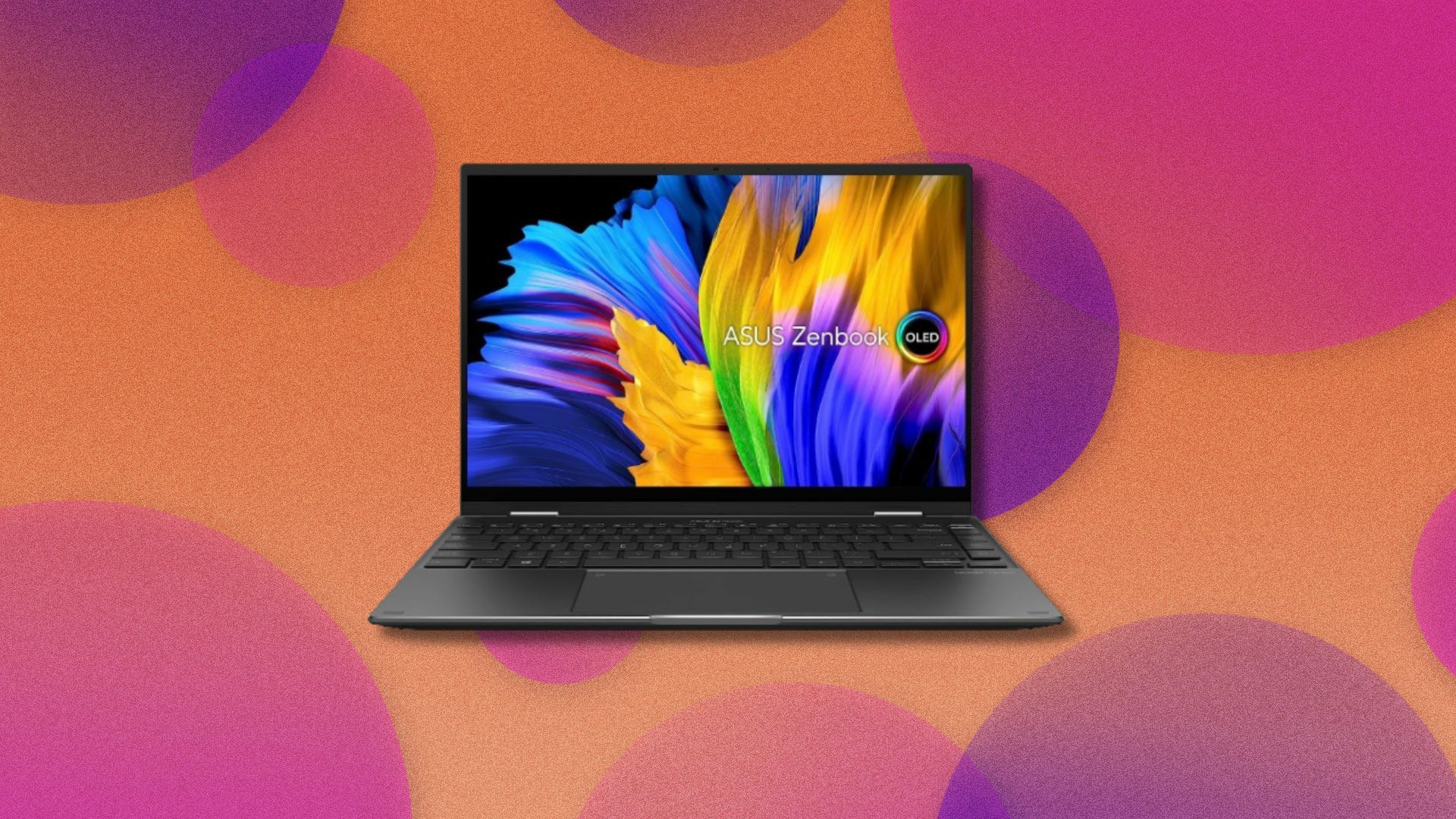 an asus zenbook 14x on a background with pink and orange