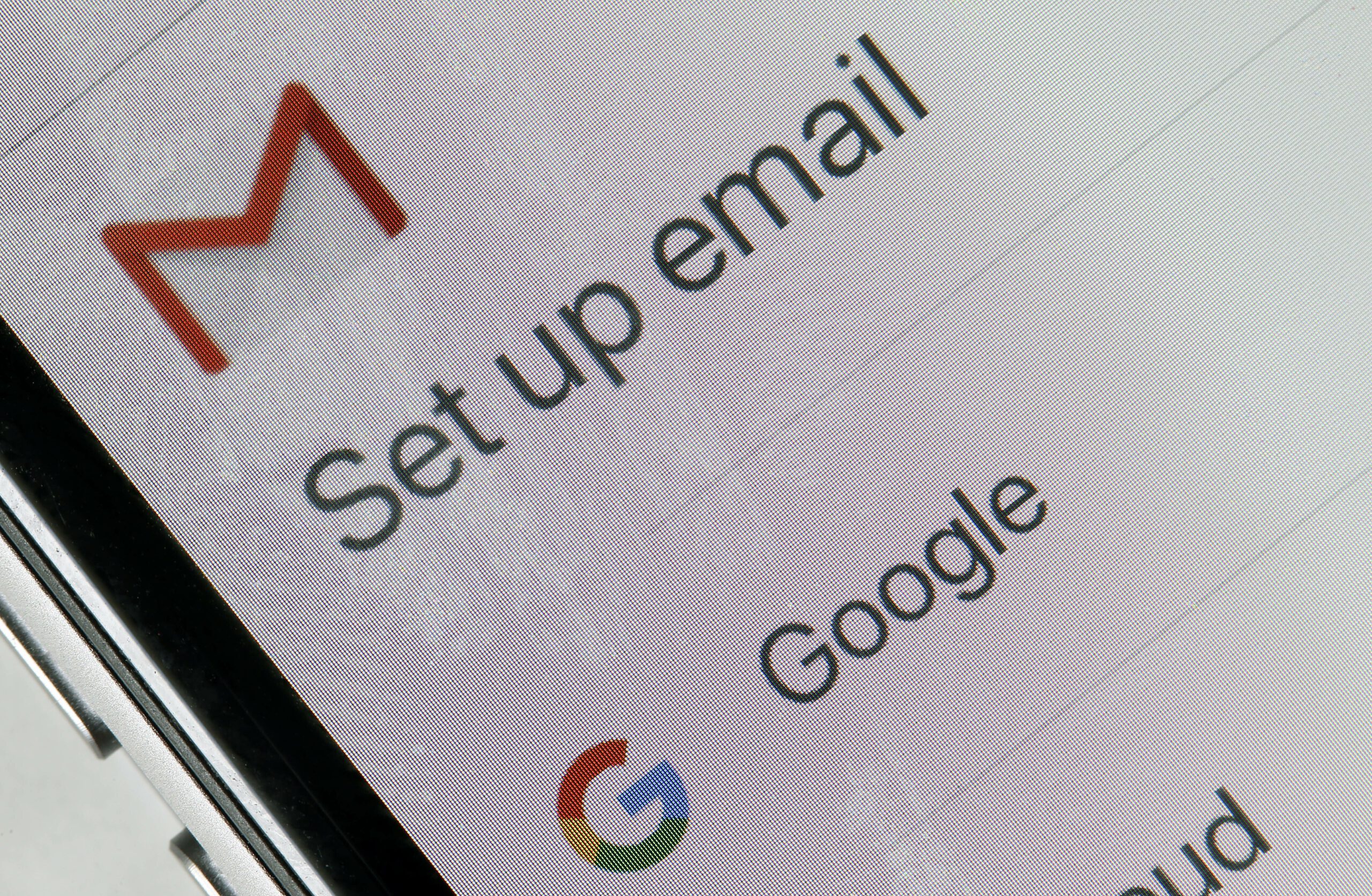 logos of the Gmail and google are seen on the screen of an iPhone