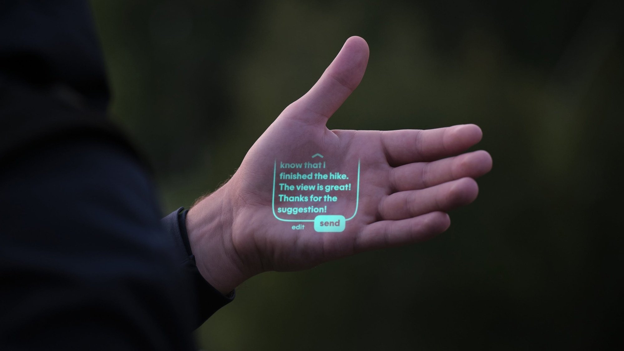 Humane AI Pin projecting into hands