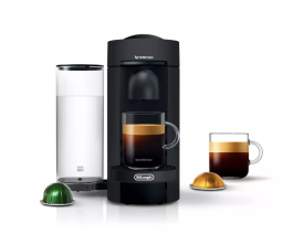 Nespresso espresso machine with two cups of coffee and capsules