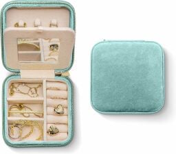 a velvet jewelry case with earrings inside