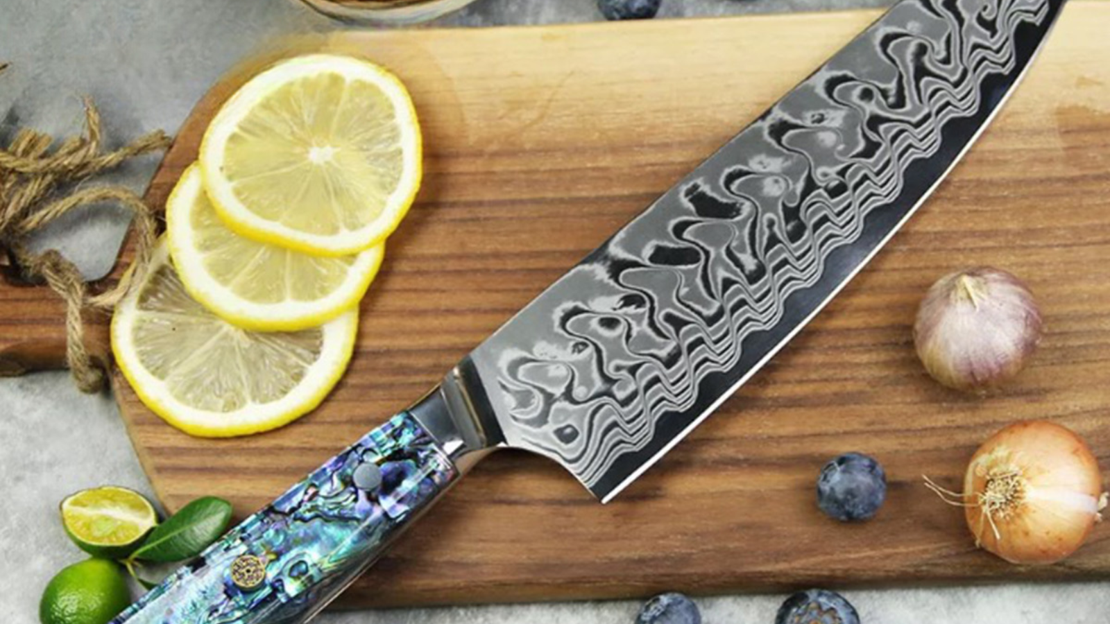 Ryori chef knife laying on cutting board with fruits and vegetables