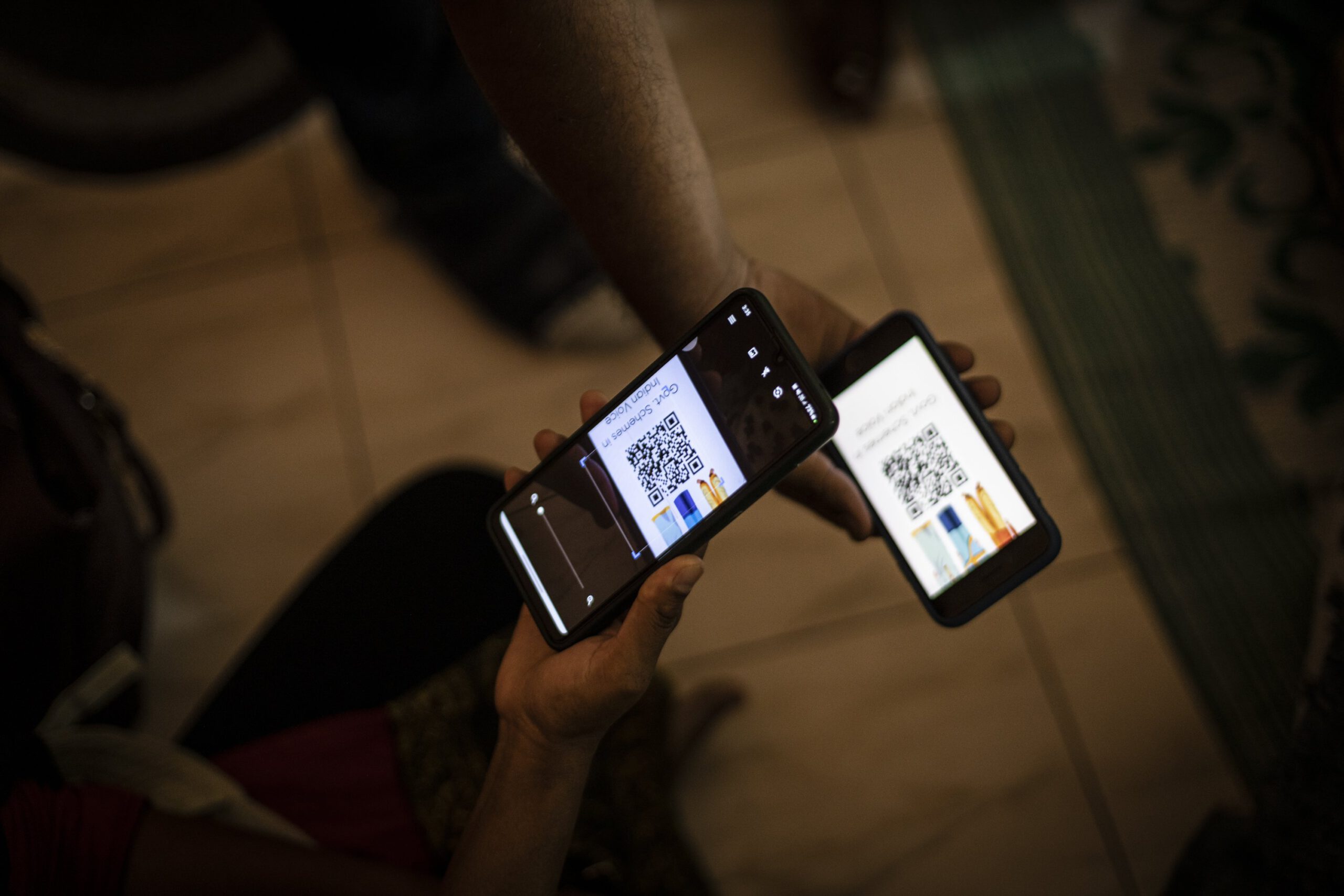 Participants scan a QR code at the Jugalbandi bot field trial
