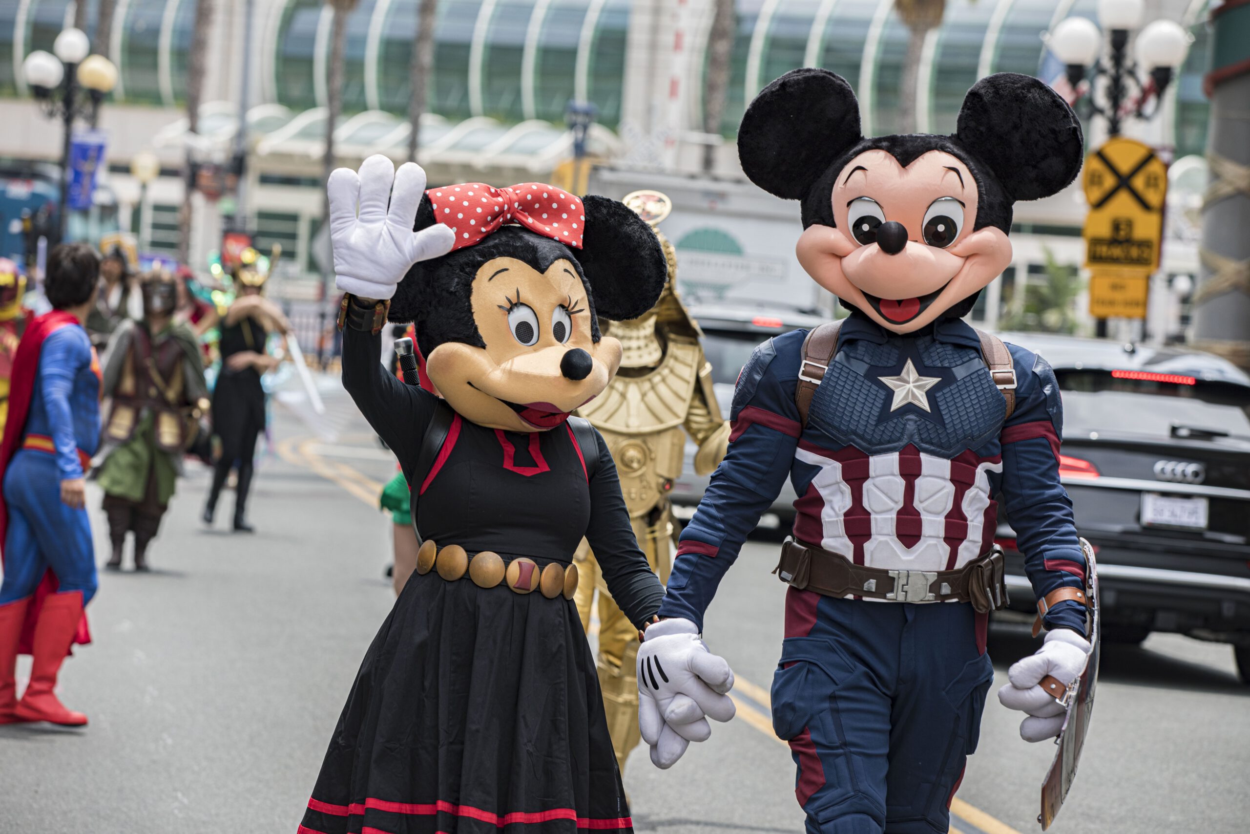 Comic Con attendees wearing Mickey and Minnie Mouse costumes