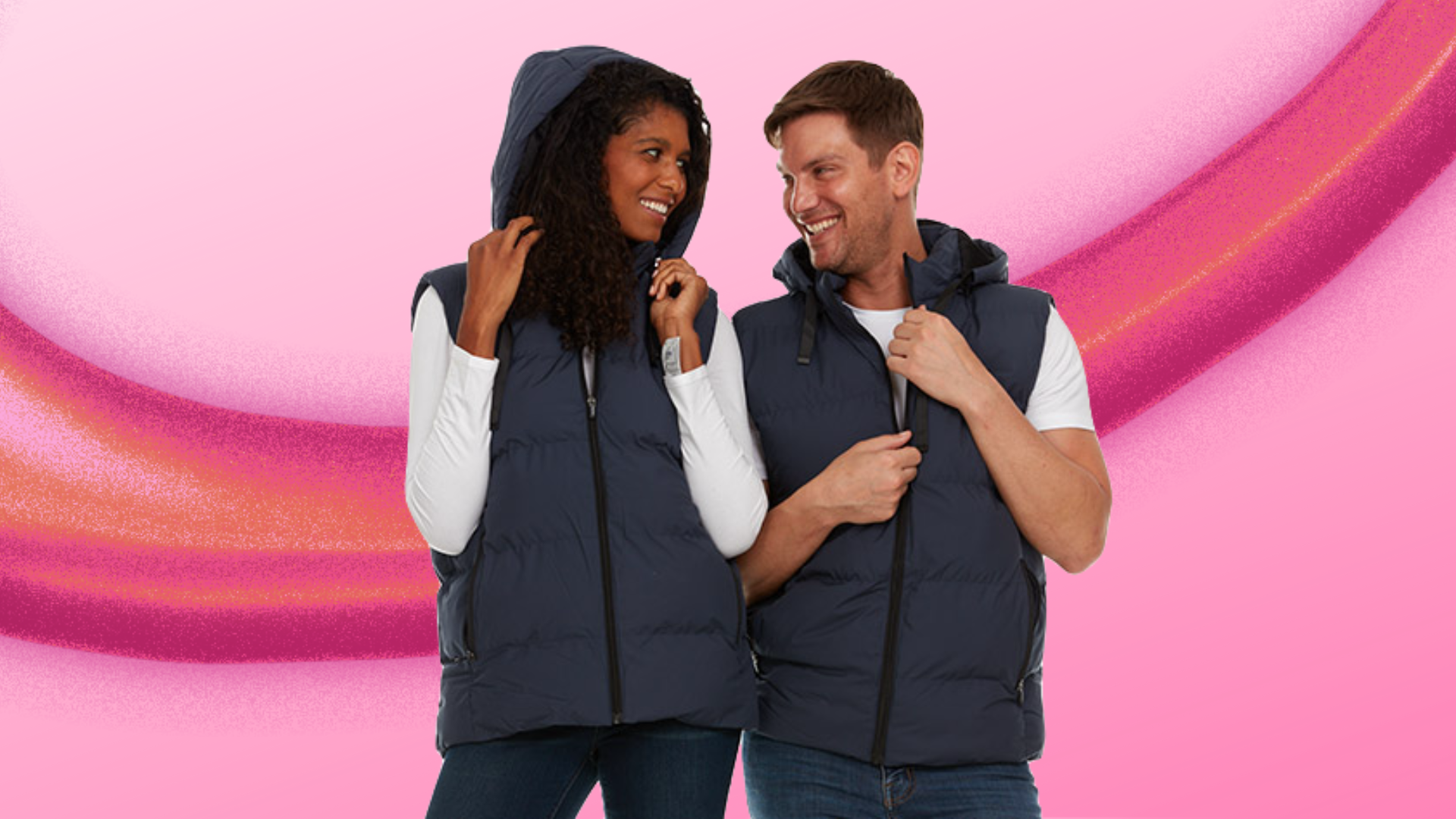 two people wearing heated vests