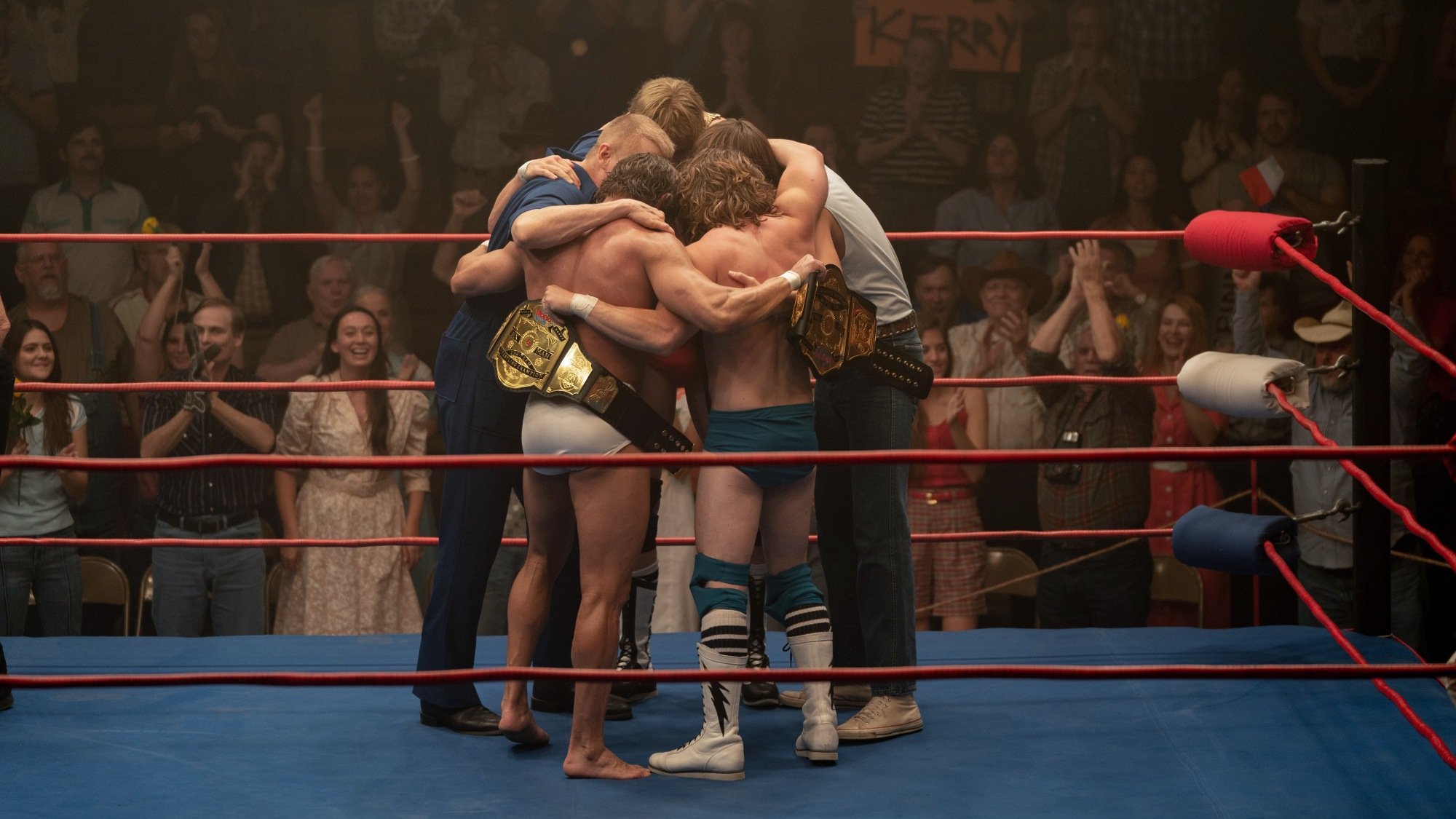 The Von Erich family huddles in the ring in "The Iron Claw."