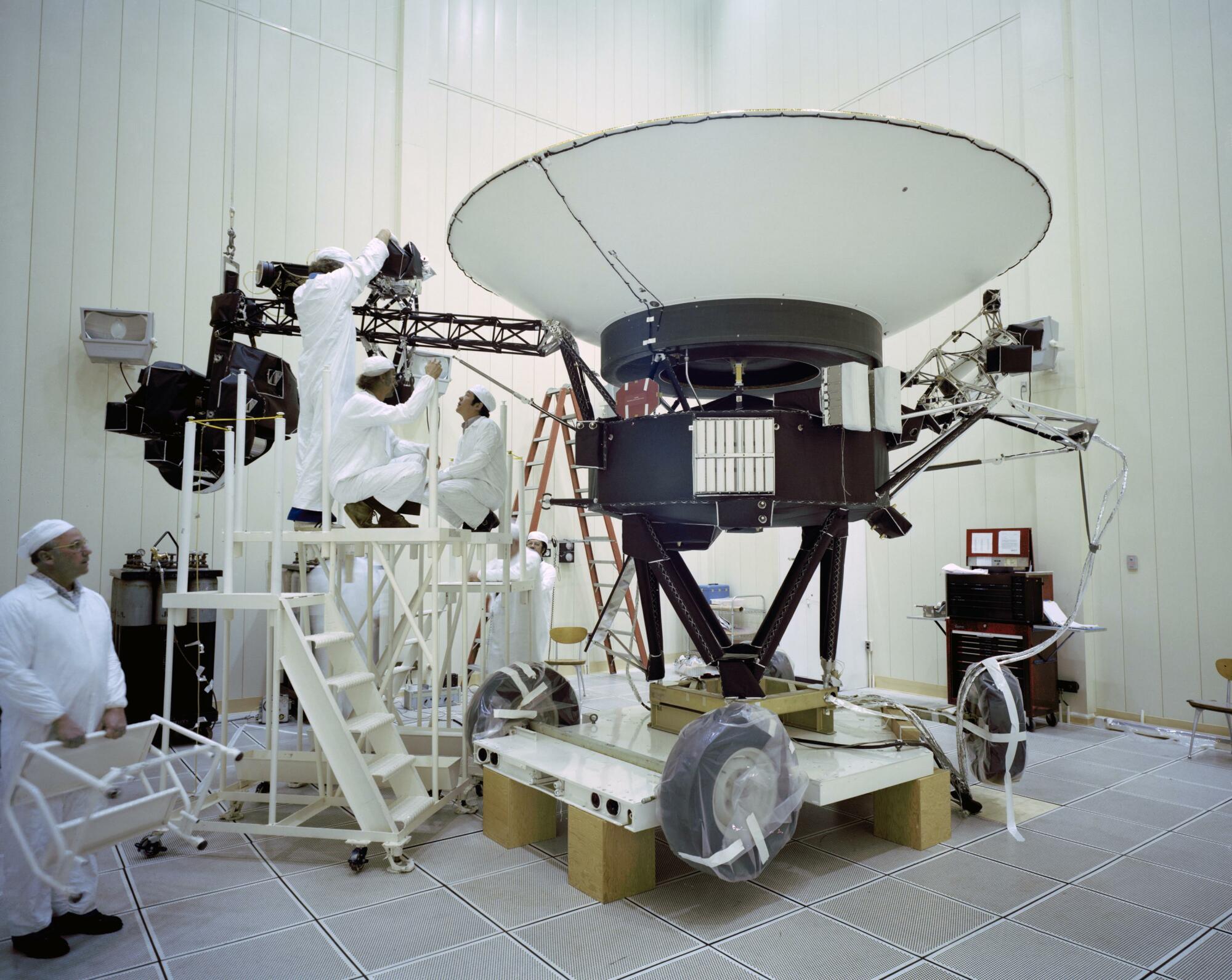 NASA engineers working on the Voyager 2 spacecraft in 1977.