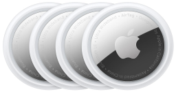 Four Apple AirTags on a white background.