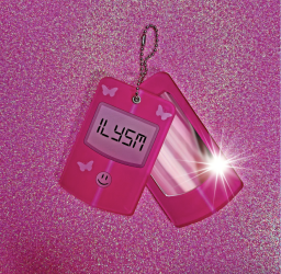 A hot pink flip phone mirror on a keychain. The front screen panel says "ILYSM."