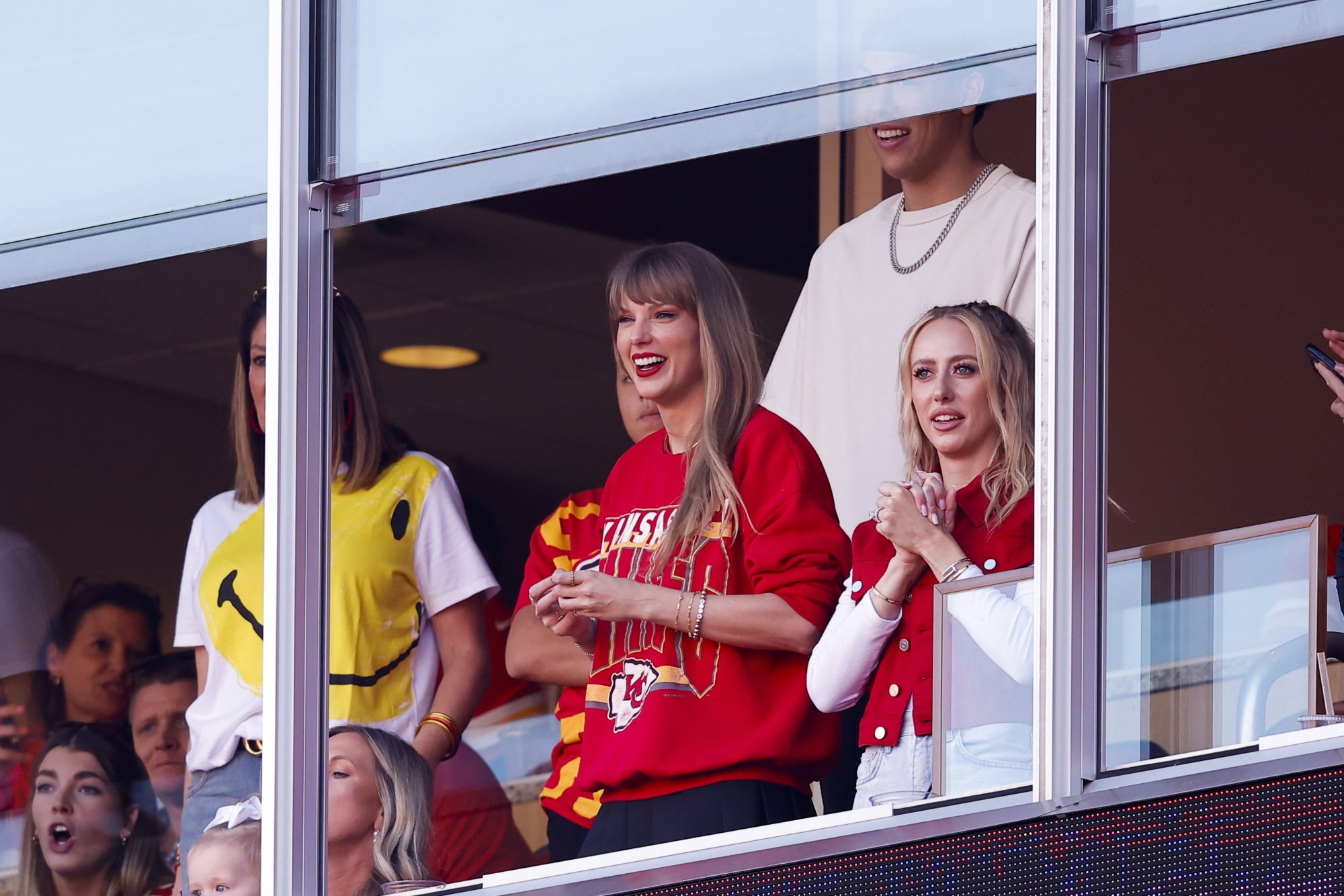 Taylor Swift in a red Chiefs sweatshirt.