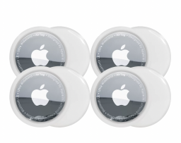 Four Apple AirTags laid out over a white background